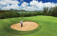 The Ile aux Cerfs Le Touessrok's picturesque golf course within stunning Mauritius.