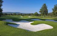 View Laranjal Golf Course's picturesque golf course in pleasing Algarve.