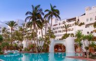 View Hotel Jardin Tropical's impressive main pool in dazzling Tenerife.