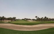 The Doha Golf Club's picturesque golf course within magnificent Qatar.