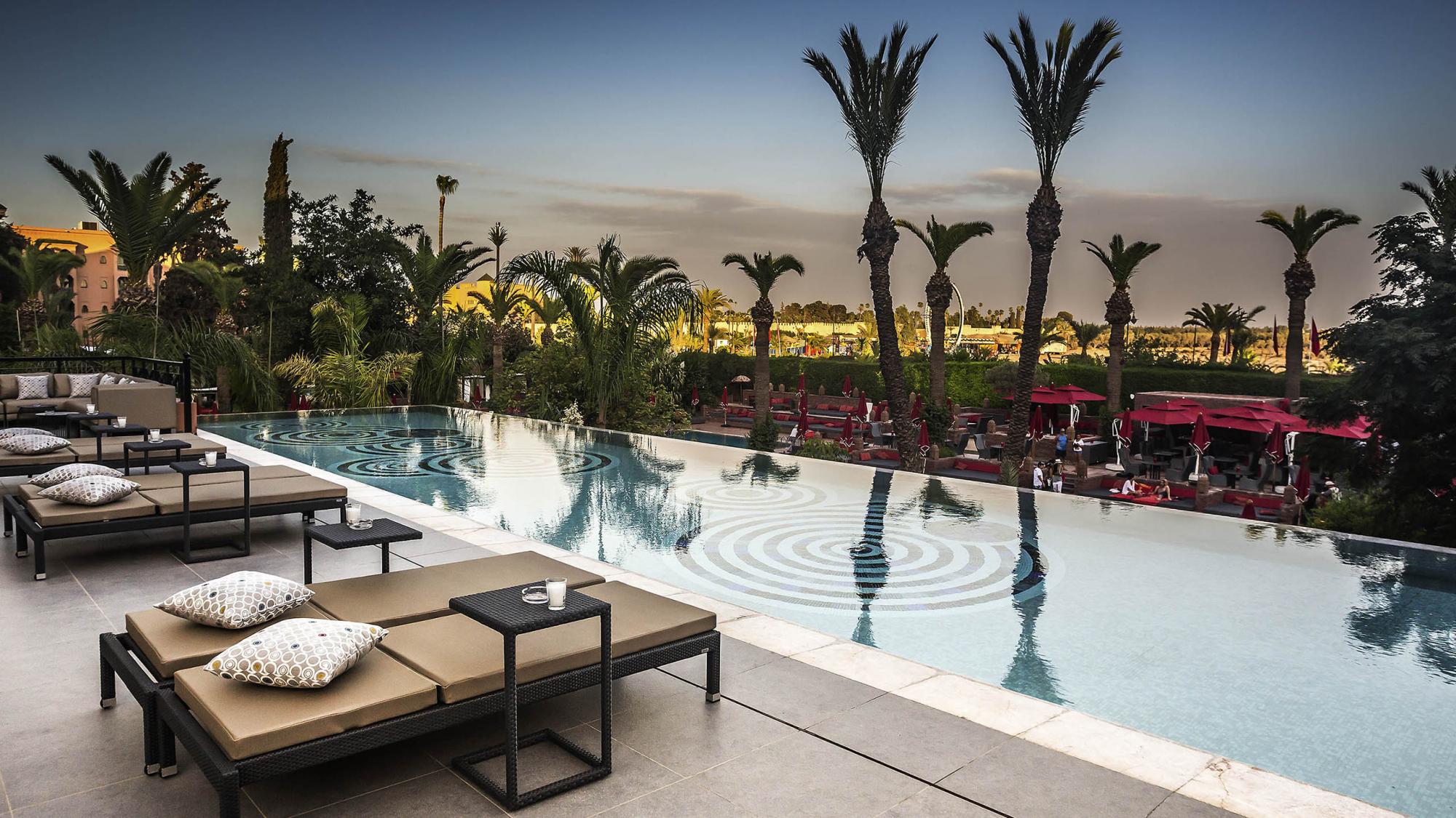 The Sofitel Marrakech Lounge  Spa Hotel's beautiful outdoor pool situated in marvelous Morocco.