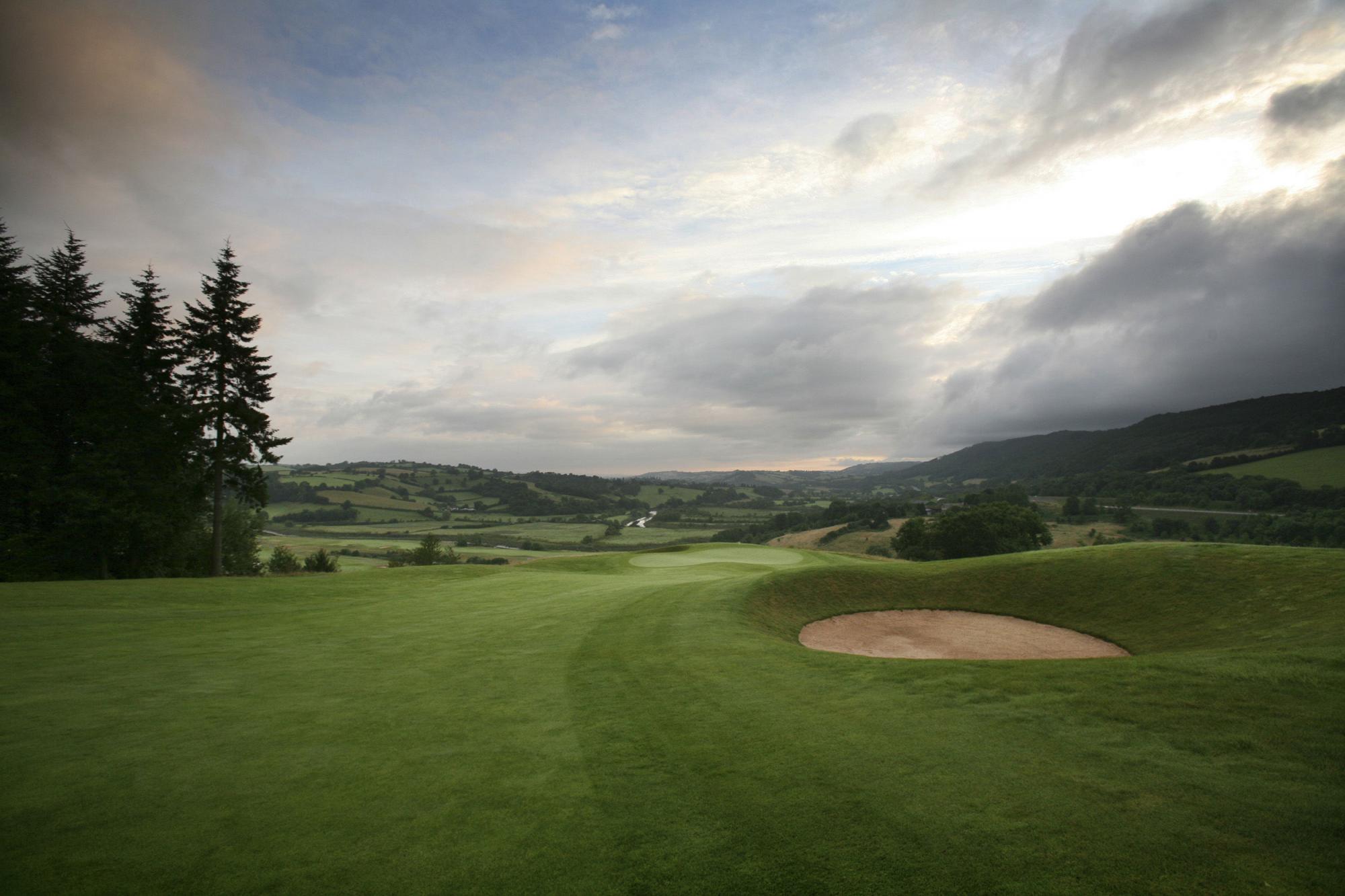 View The Montgomerie Course at Celtic Manor Resort's picturesque golf course within dazzling Wales.