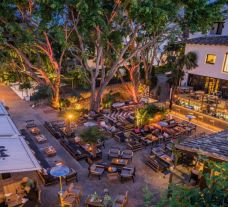 View Hotel Puente Romano's picturesque outdoor restaurant within magnificent Costa Del Sol.