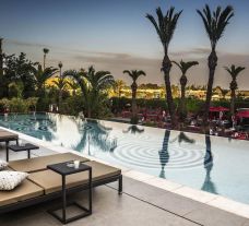 The Sofitel Marrakech Lounge  Spa Hotel's beautiful outdoor pool situated in marvelous Morocco.