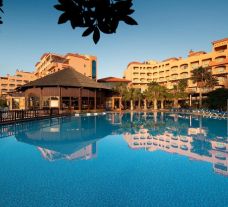 The Elba Sara Beach  Golf Resort's picturesque outdoor pool in pleasing Fuerteventura.