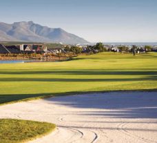 The Arabella Golf Club's picturesque golf course situated in impressive South Africa.