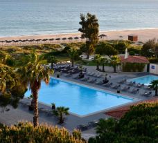 View Pestana Dom Joao II Hotel's picturesque outdoor pool within vibrant Algarve.