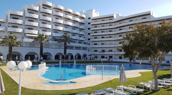 View Hotel Brisa Sol's picturesque outdoor pool within vibrant Algarve